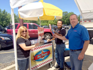 From left, Kristie Thompson, Benny Chavez and Mike O’Connor gather for some ice cream treats. 